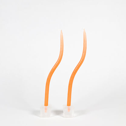 Thin orange squiggly taper candles