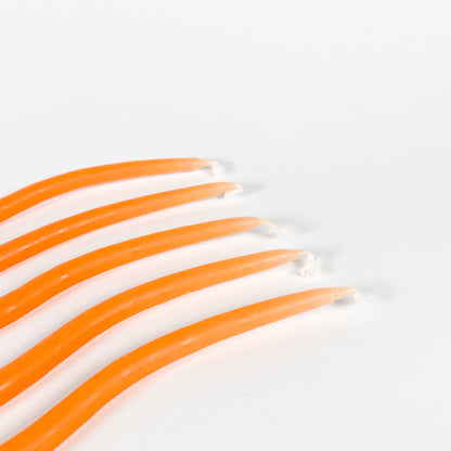 Thin orange squiggly taper candles