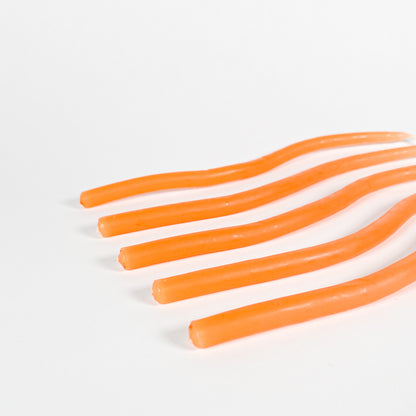 Thin orange squiggly taper candles