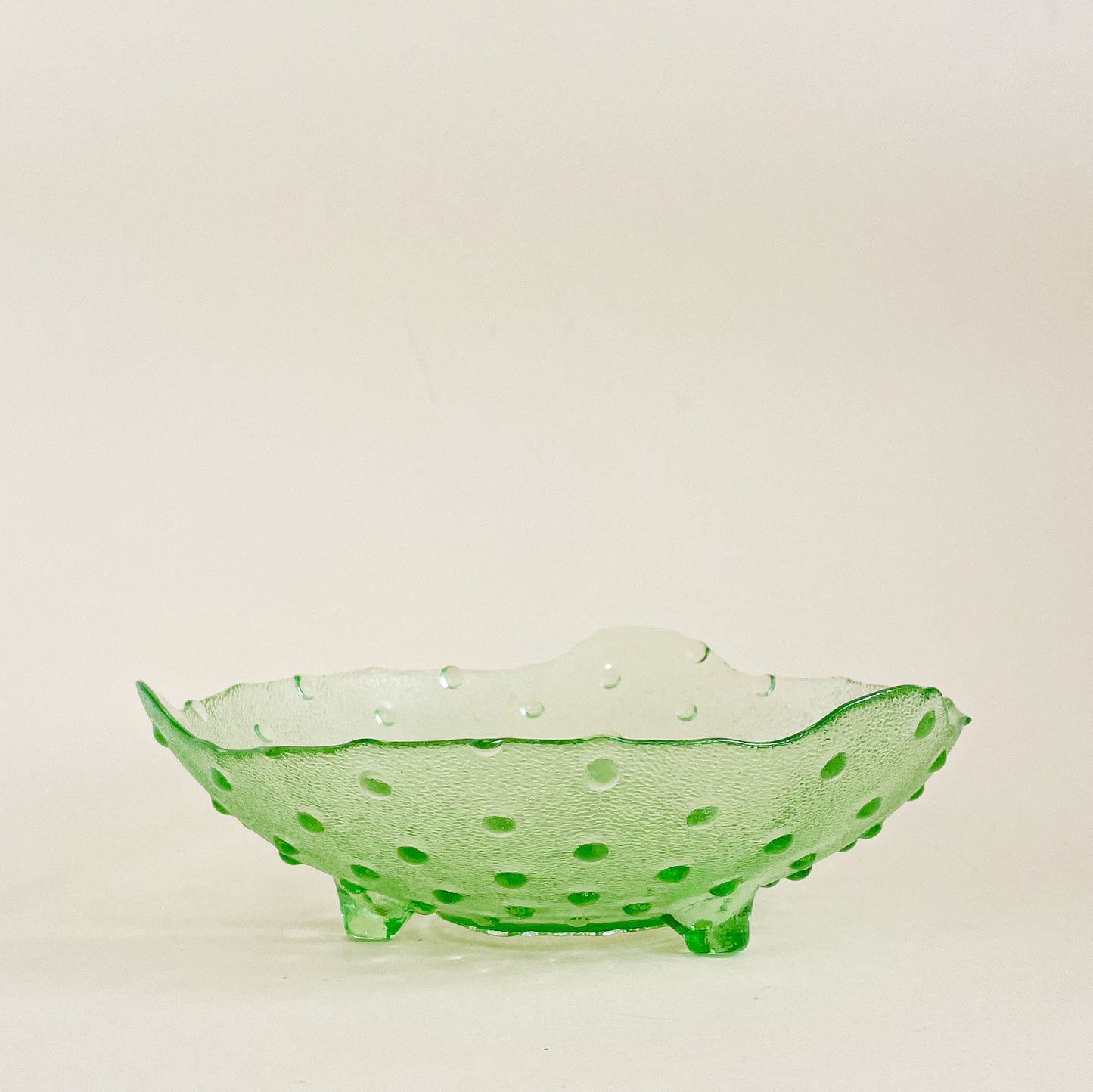 Green hobnail footed glass bowl