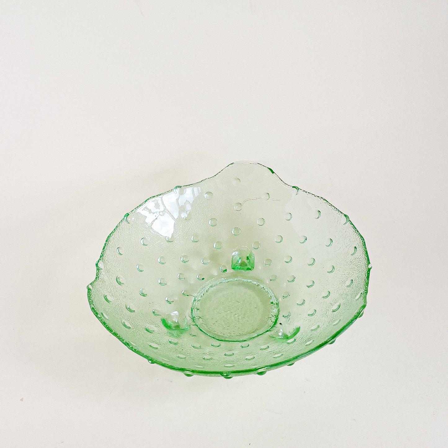 Green hobnail footed glass bowl