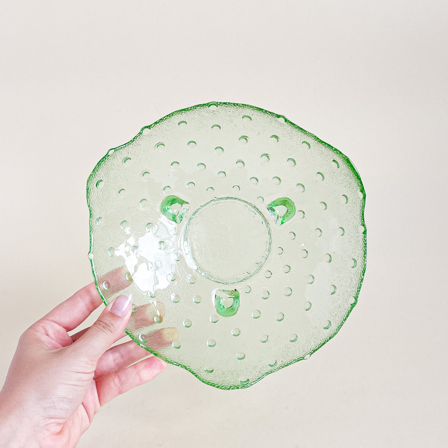 Green hobnail footed glass bowl