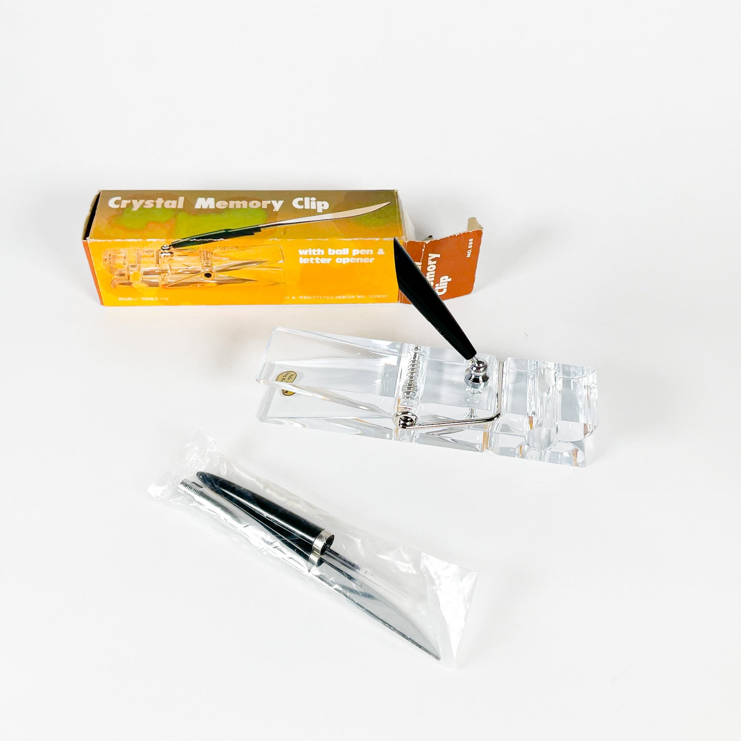 Pince en lucite et stylo/coupe-papier