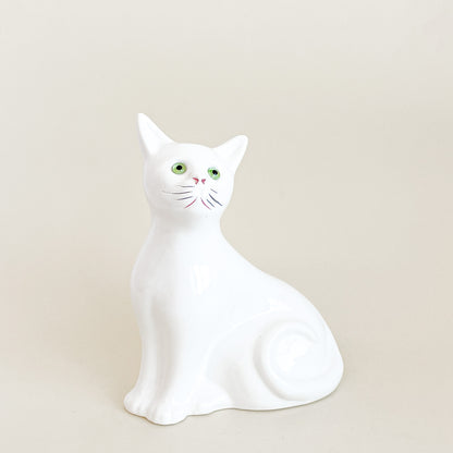 White cat with green eyes