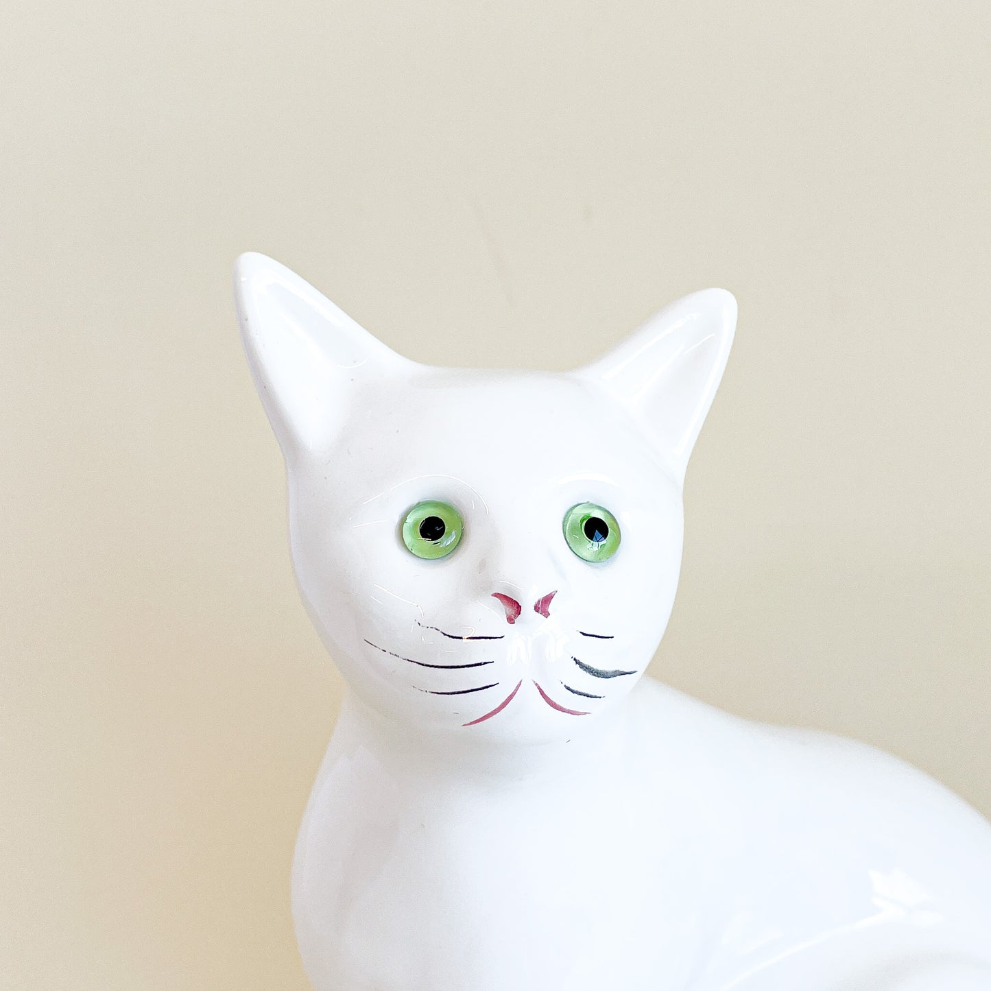 White cat with green eyes