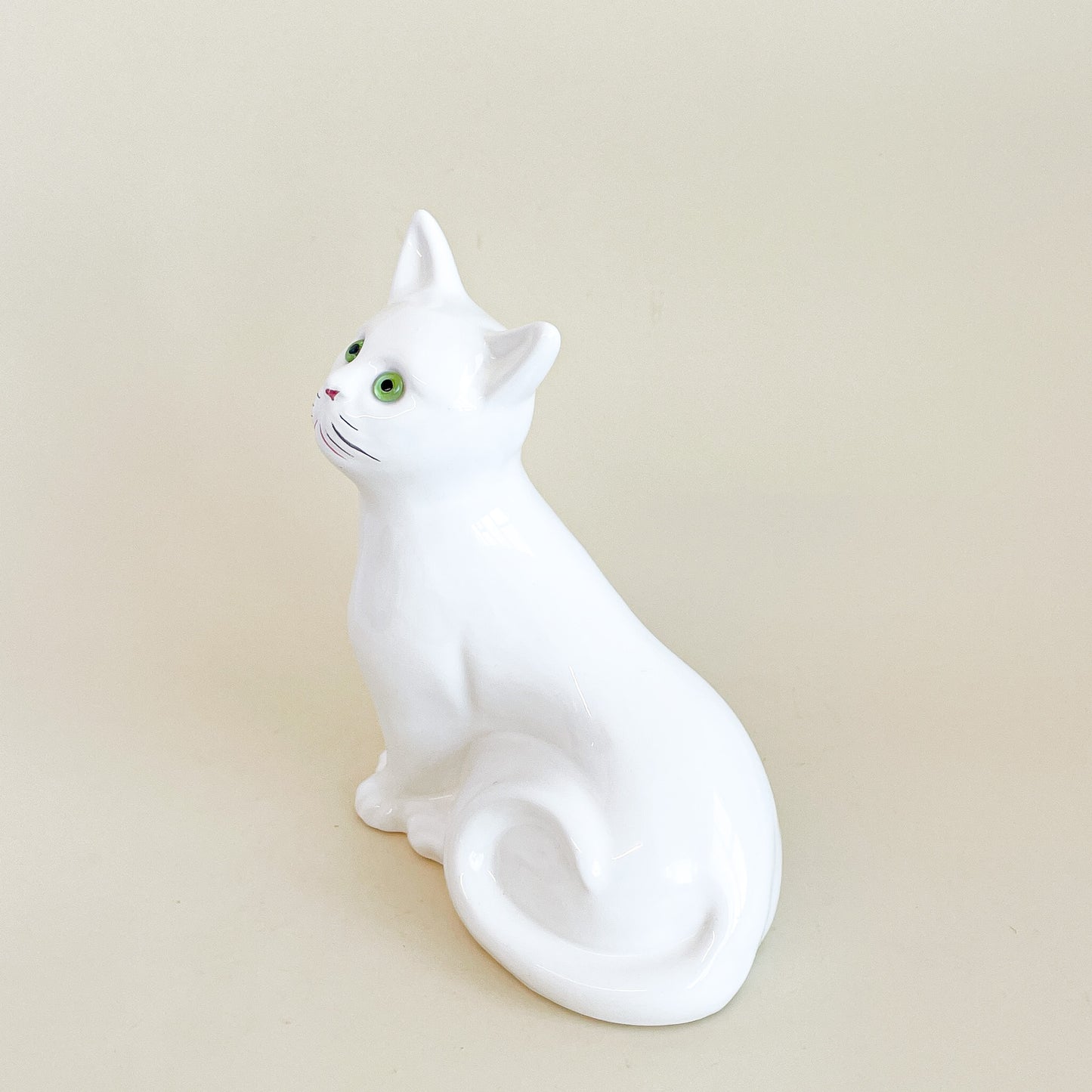 White cat with green eyes