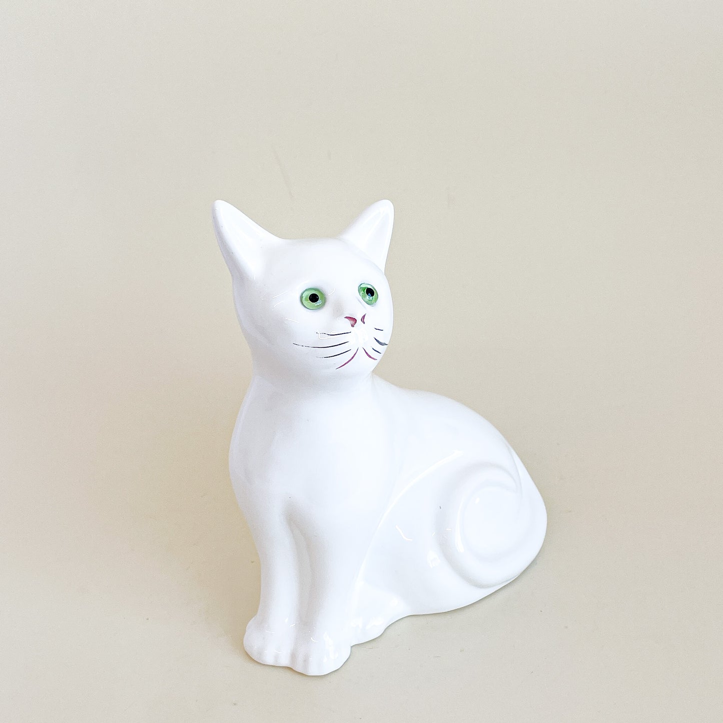 White cat with green eyes