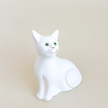 White cat with green eyes