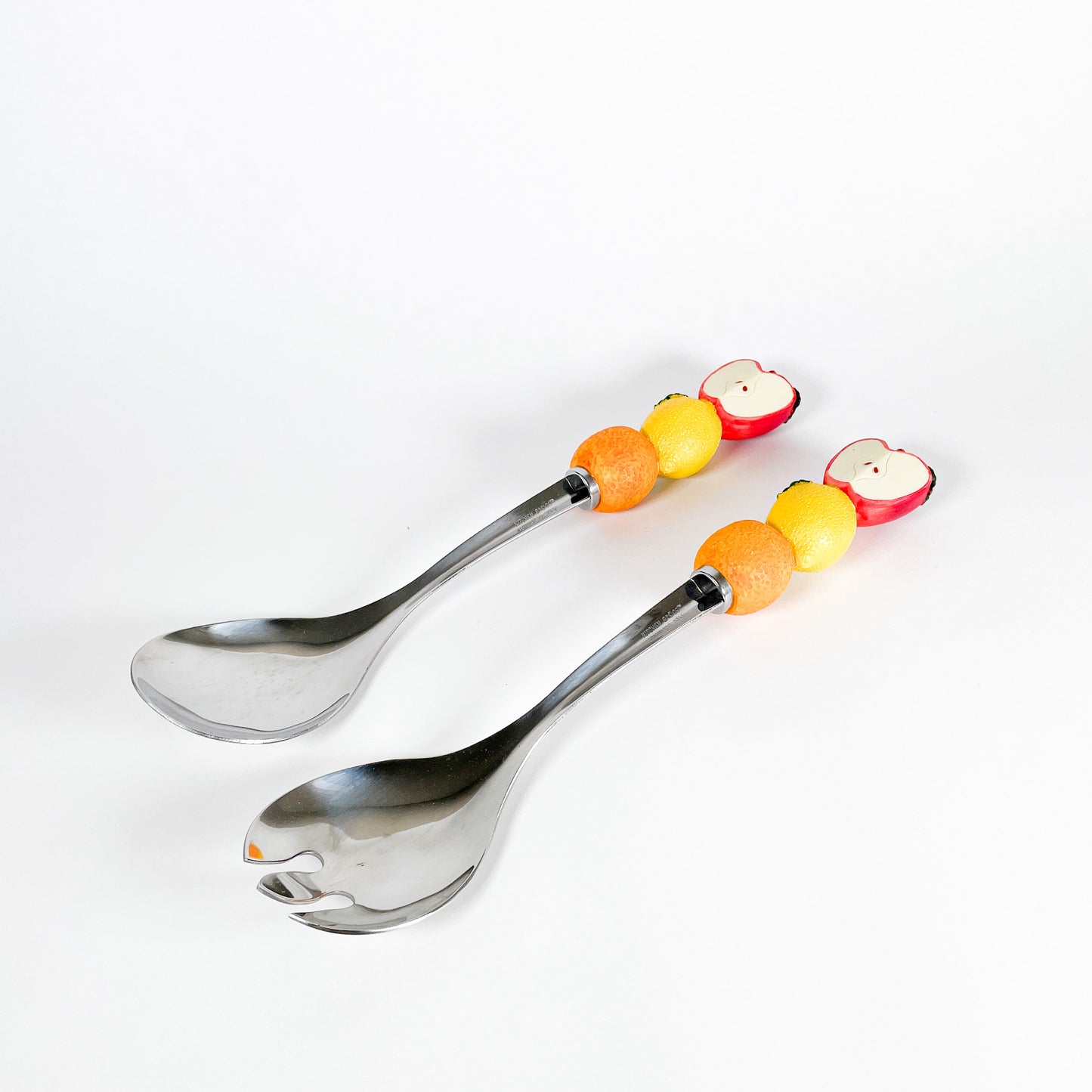 Fruits salad serving spoons