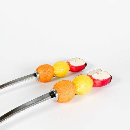 Fruits salad serving spoons