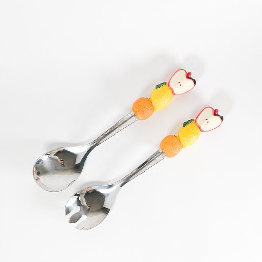 Fruits salad serving spoons