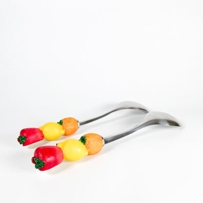 Fruits salad serving spoons