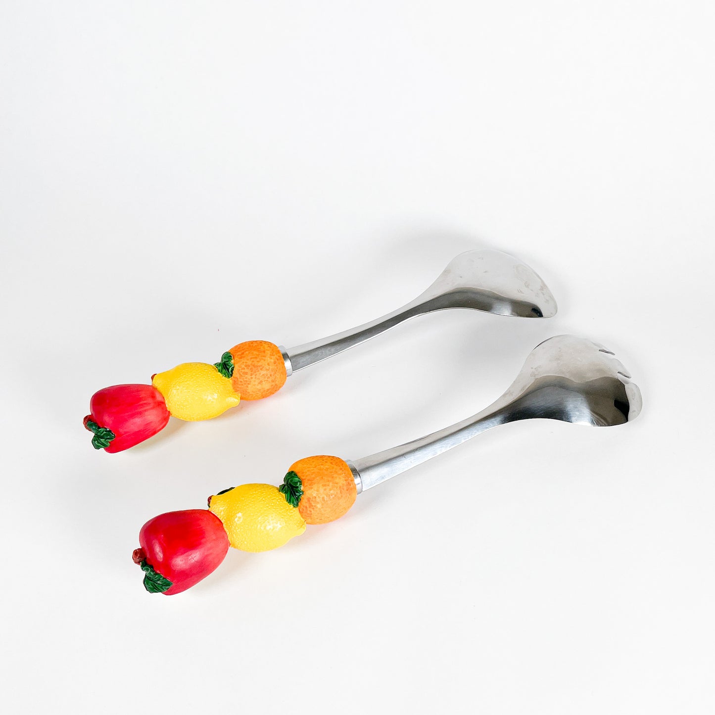 Fruits salad serving spoons