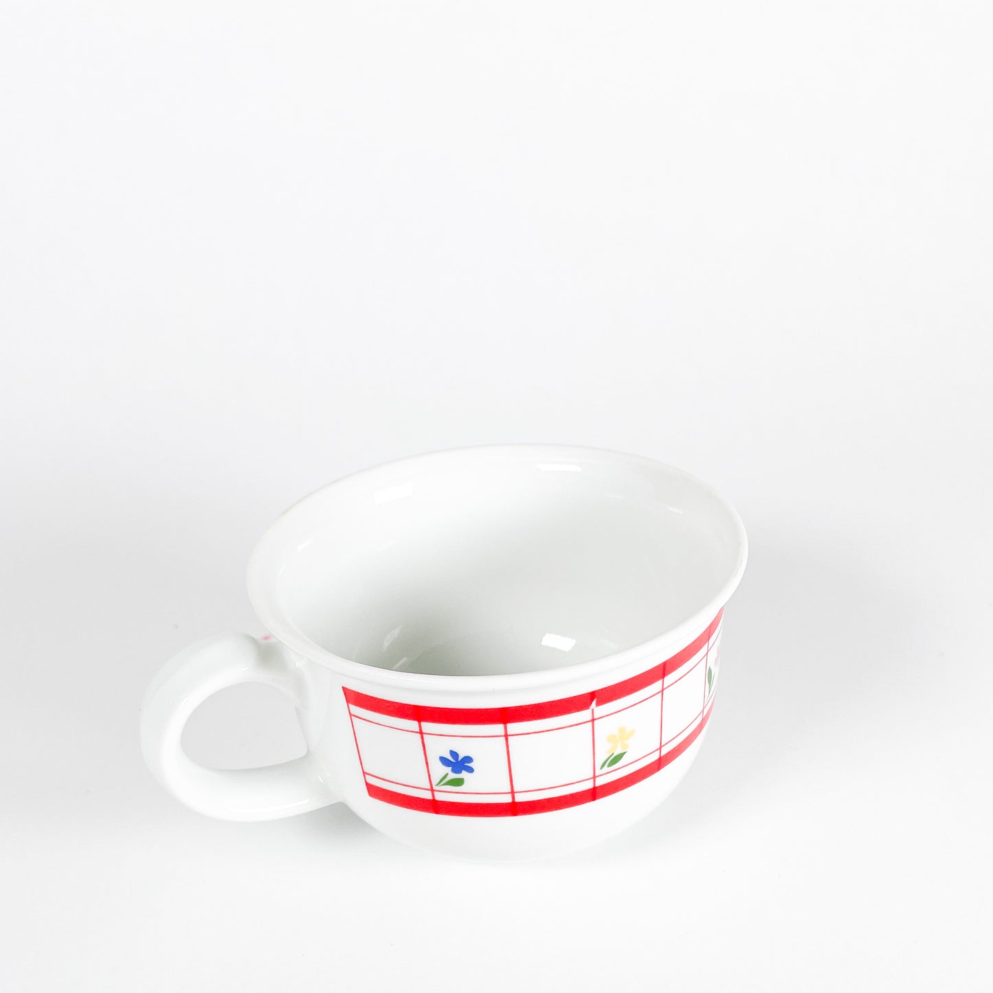 Red checkered mug with small flowers