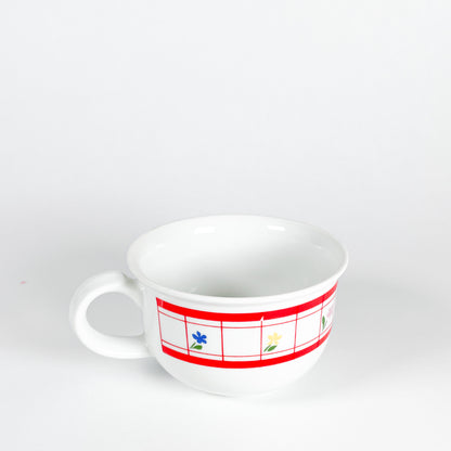 Red checkered mug with small flowers