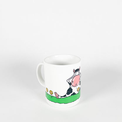 Cow in the meadow mug