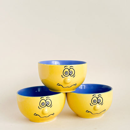 Yellow 3D faces bowls set