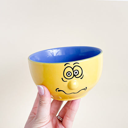 Yellow 3D faces bowls set