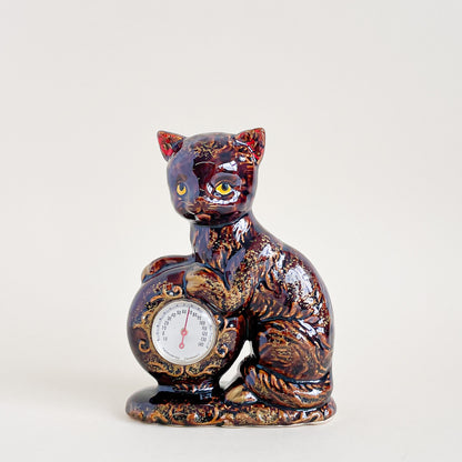 Brown and gold cat thermometer