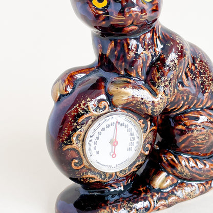 Brown and gold cat thermometer