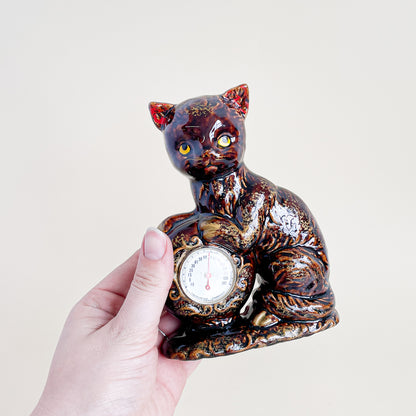 Brown and gold cat thermometer